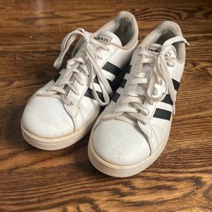 White and black stripped adidas shoe